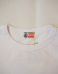 BUZZ RICKSON'S (バズリクソンズ) × PEANUTS (ピーナッツ) 長袖スヌーピーTシャツ BR69276 "U.S.NAVAL TRAINING CENTER" ホワイト
